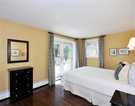 598 Lexington Road Concord, MA 01742 - Photo 8 of 15 a bedroom with a bed and a window