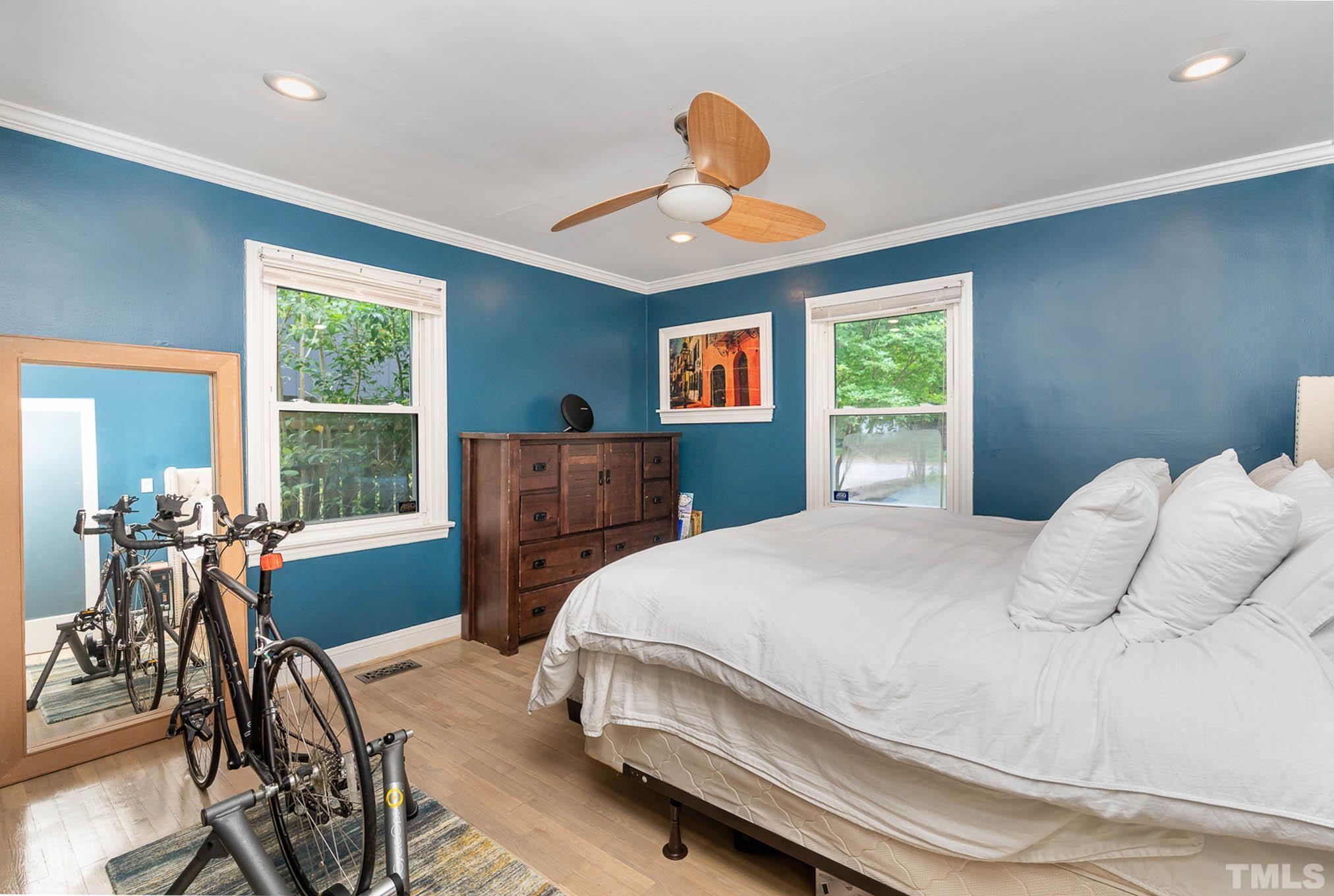 703 Van Buren Road Raleigh, NC 27604 - Photo 12 of 16 a bedroom with a bed and a large window with chair