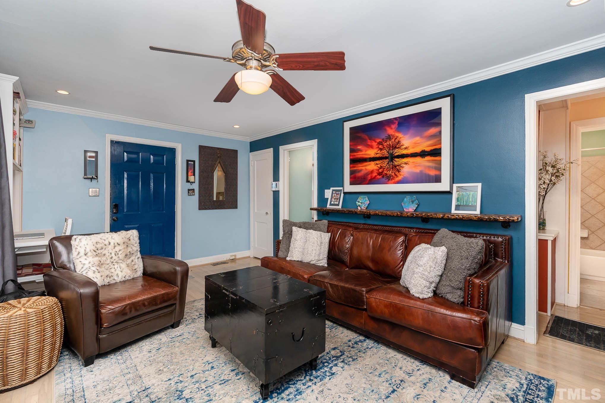 703 Van Buren Road Raleigh, NC 27604 - Photo 4 of 16 a living room with furniture and a flat screen tv