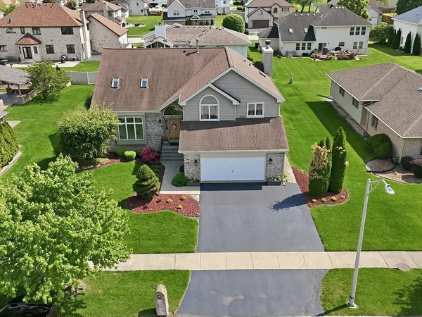 an aerial view of a house with a garden