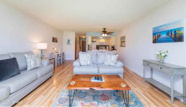 a living room with furniture and a rug