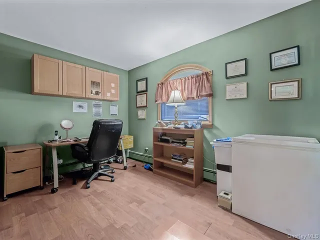 a room with furniture and a workspace