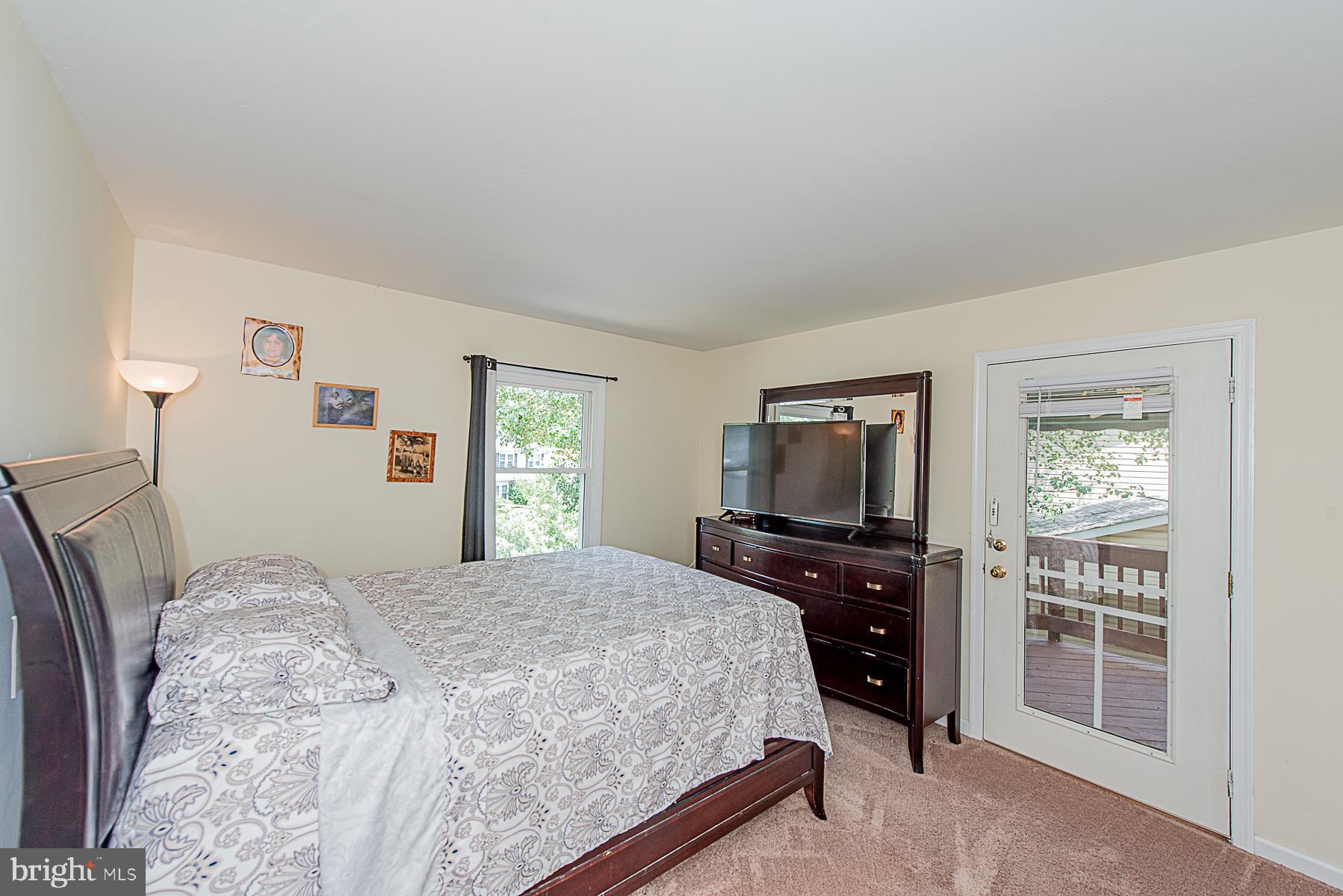 1308 Tenbrook Road Odenton, MD 21113 - Photo 14 of 32 MASTER BEDROOM WITH WALK-OUT TO PRIVATE DECK
