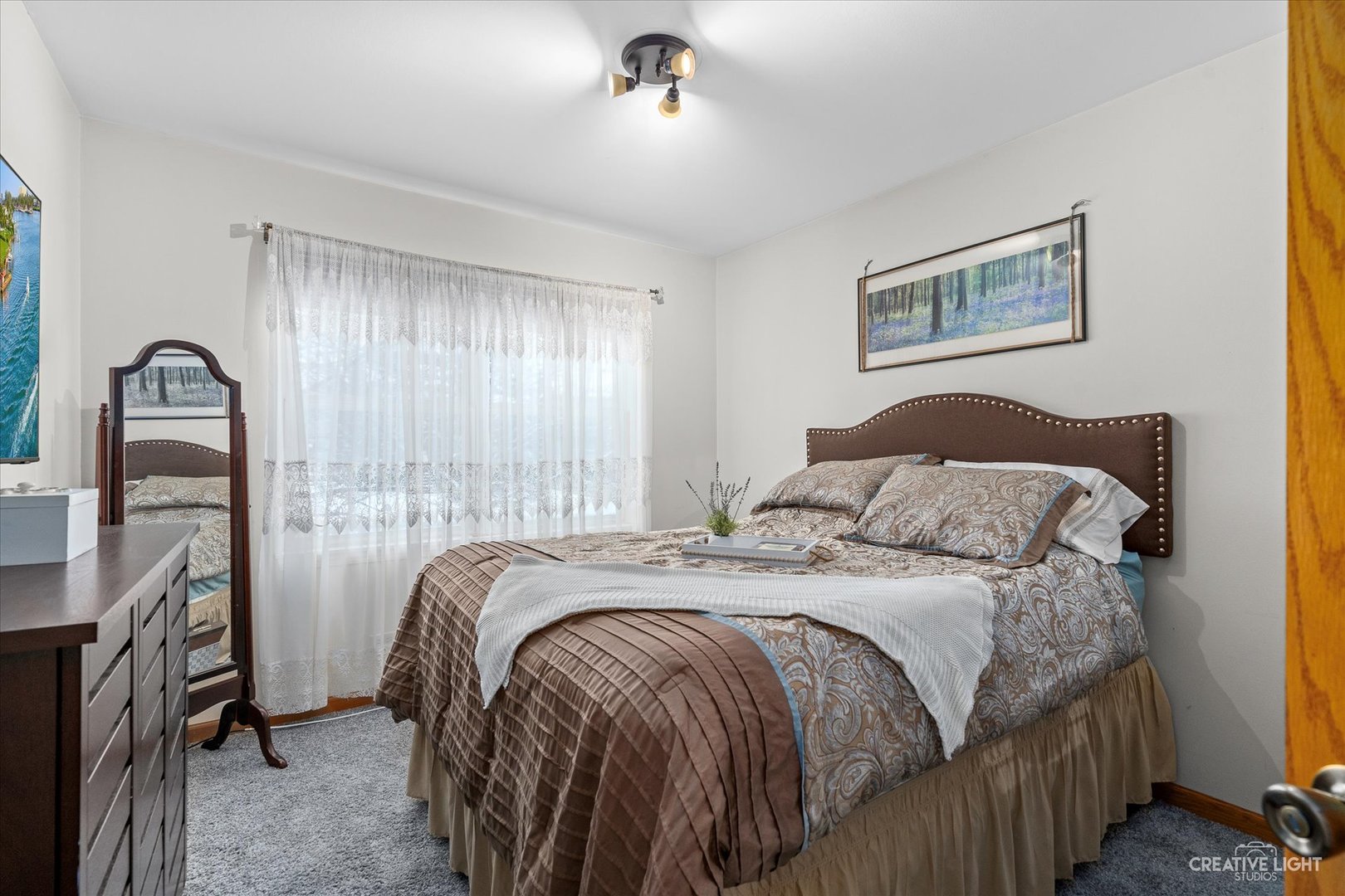 2834 Miller Road Geneva, IL 60134 - Photo 16 of 23 a bedroom with a bed next to a window