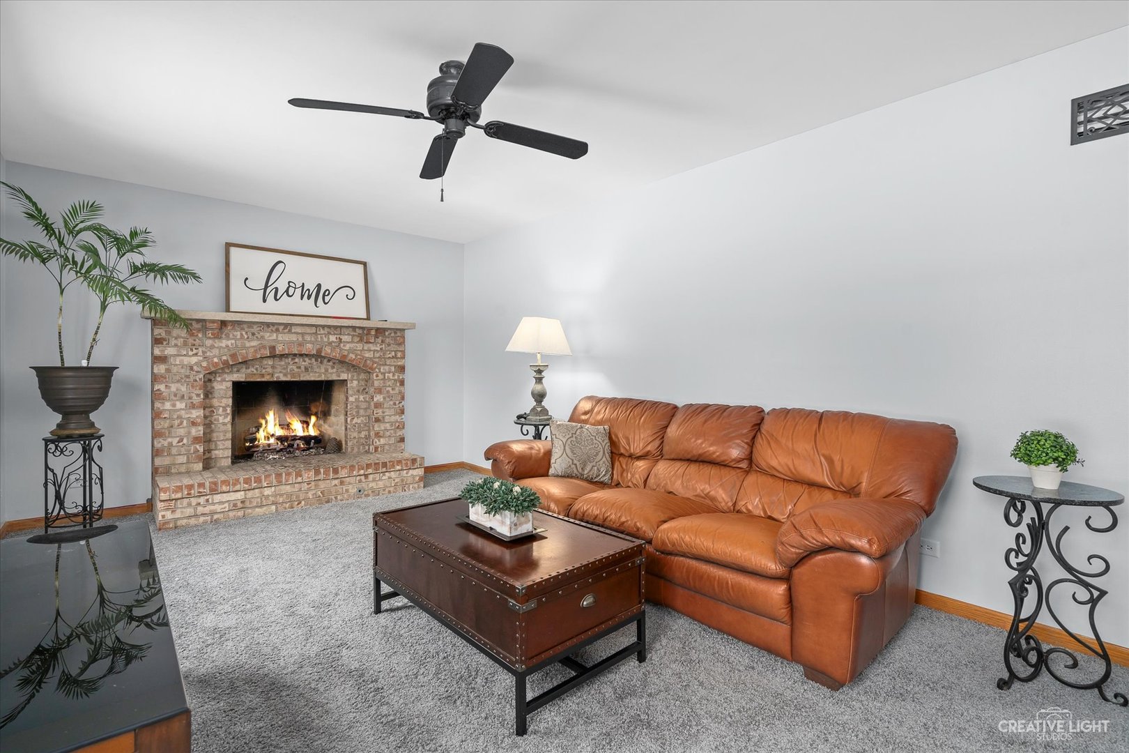 2834 Miller Road Geneva, IL 60134 - Photo 4 of 23 a living room with furniture and a fireplace
