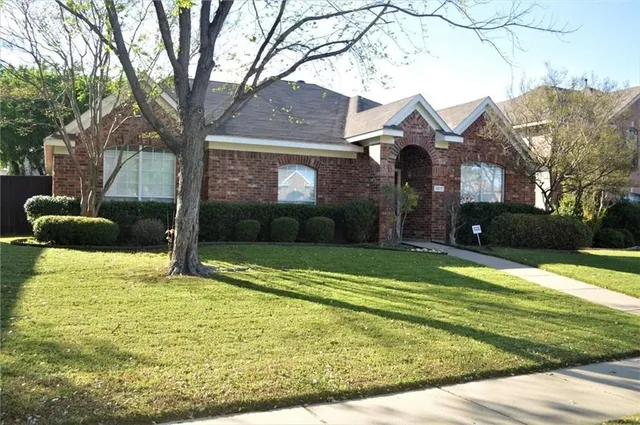 a house view with a garden space