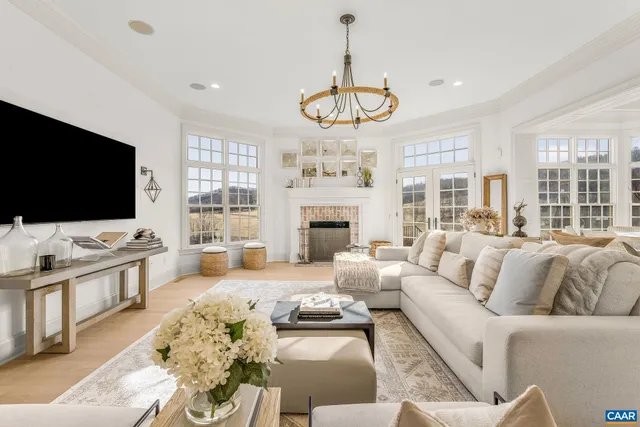 a view of a hallway with wooden floor and cabinet