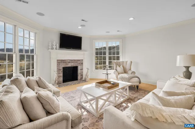 a picture of floor with a white wall and a painting