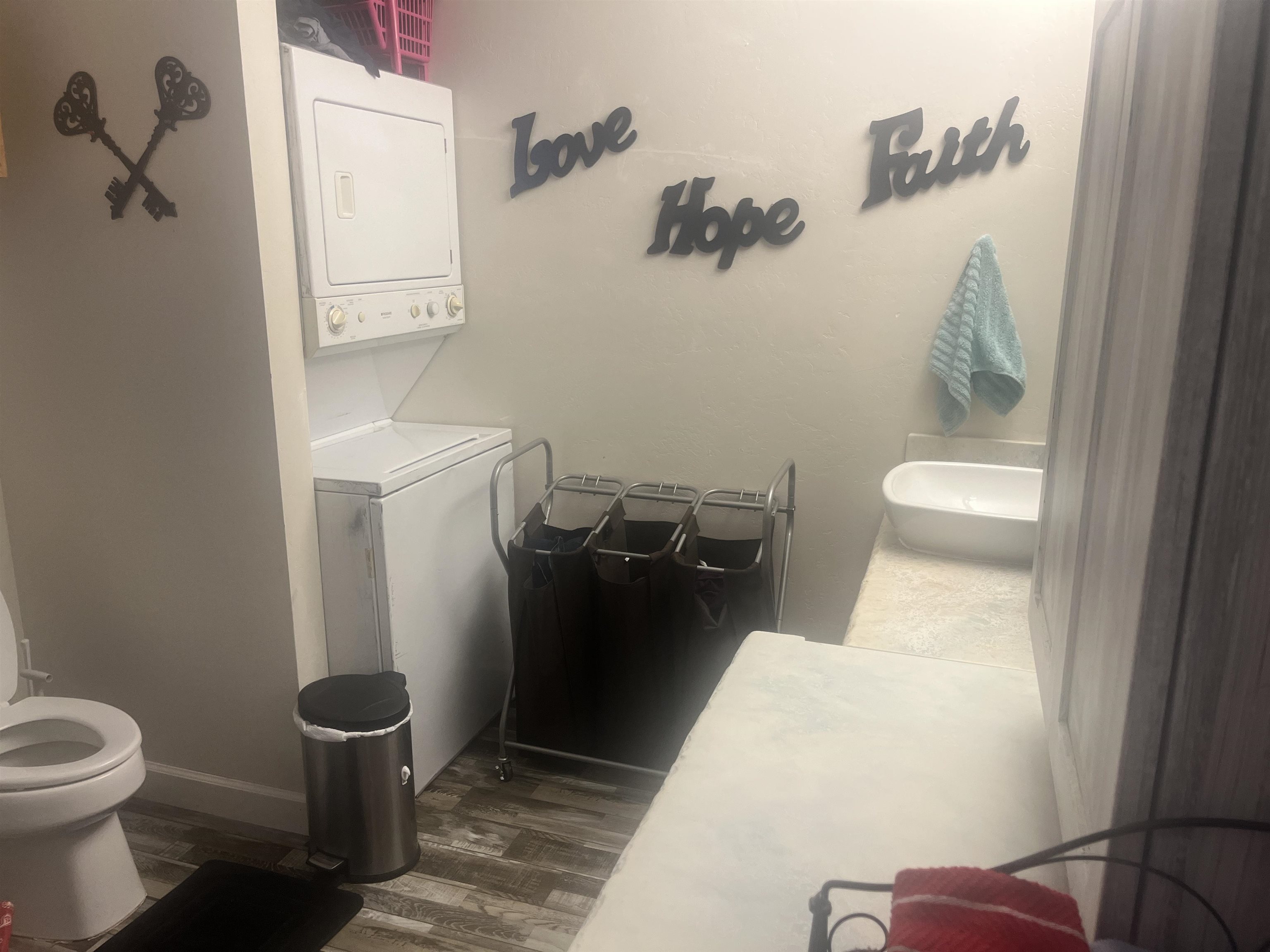 1729 10 Road Mack, CO 81525 - Photo 10 of 25 a bathroom with a toilet and a mirror