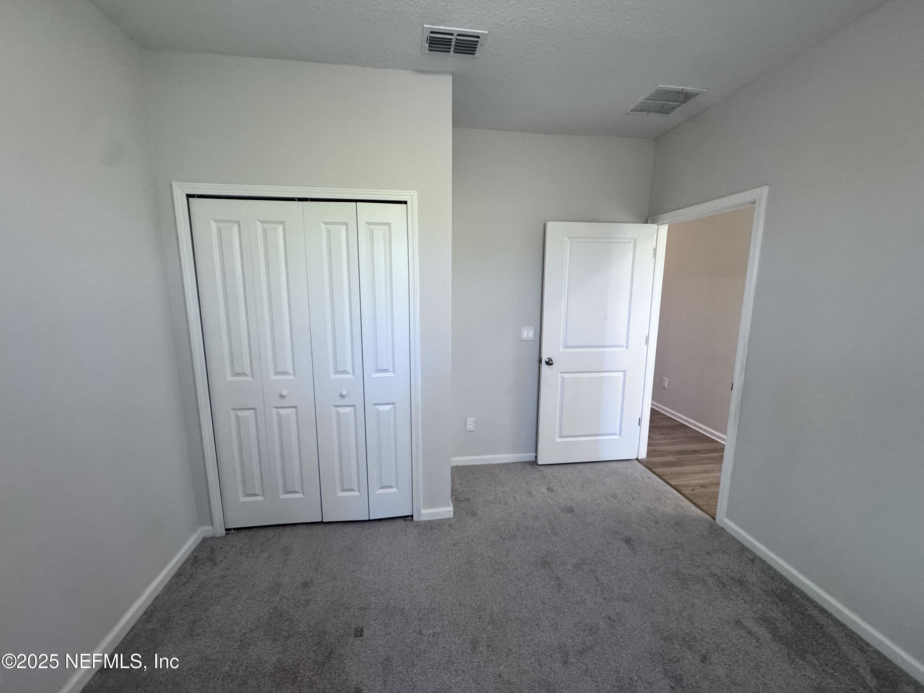 156 Charlie Way St. Augustine, FL 32095 - Photo 19 of 33 an empty room with closet
