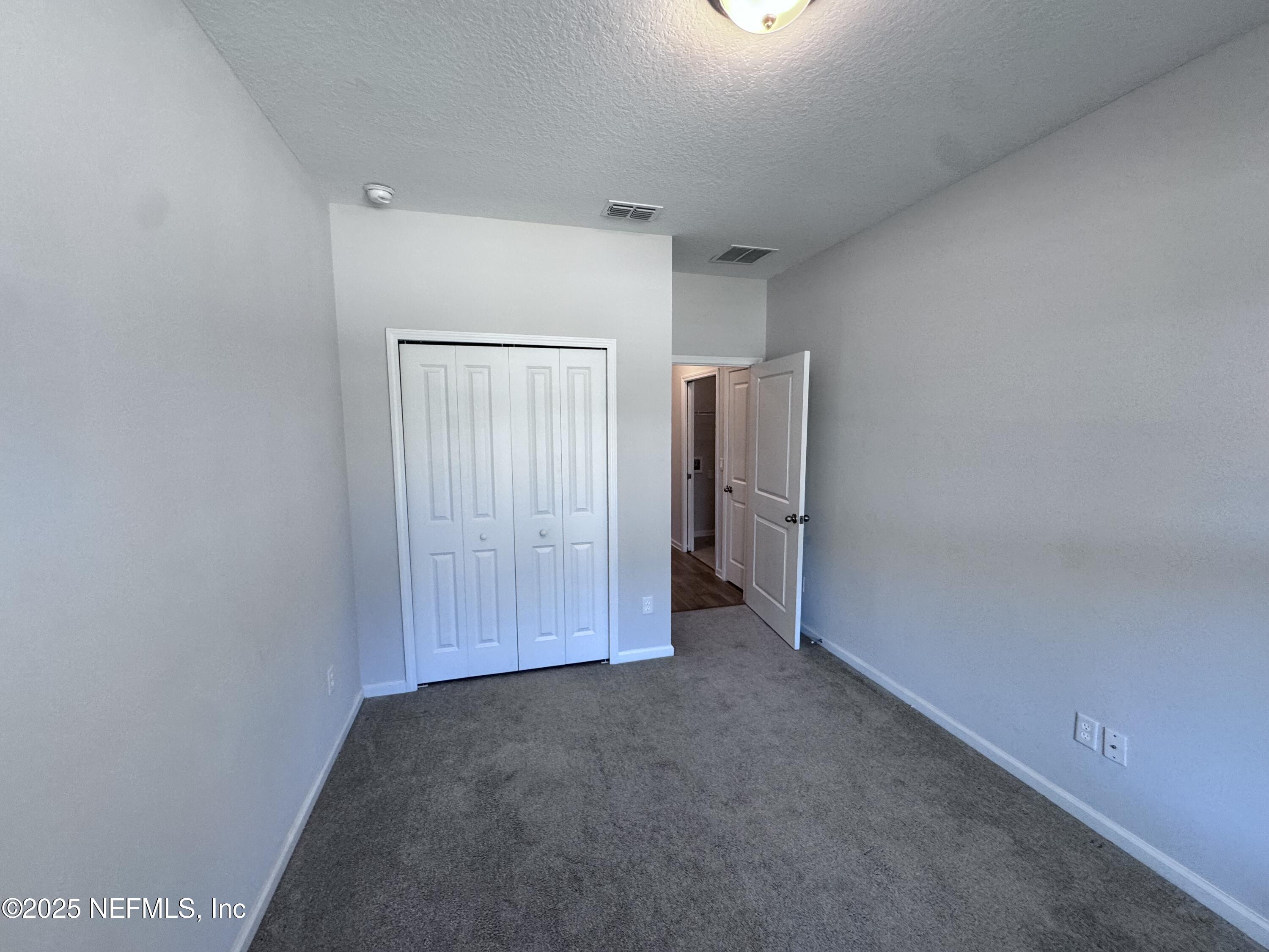 156 Charlie Way St. Augustine, FL 32095 - Photo 24 of 33 a view of an empty room