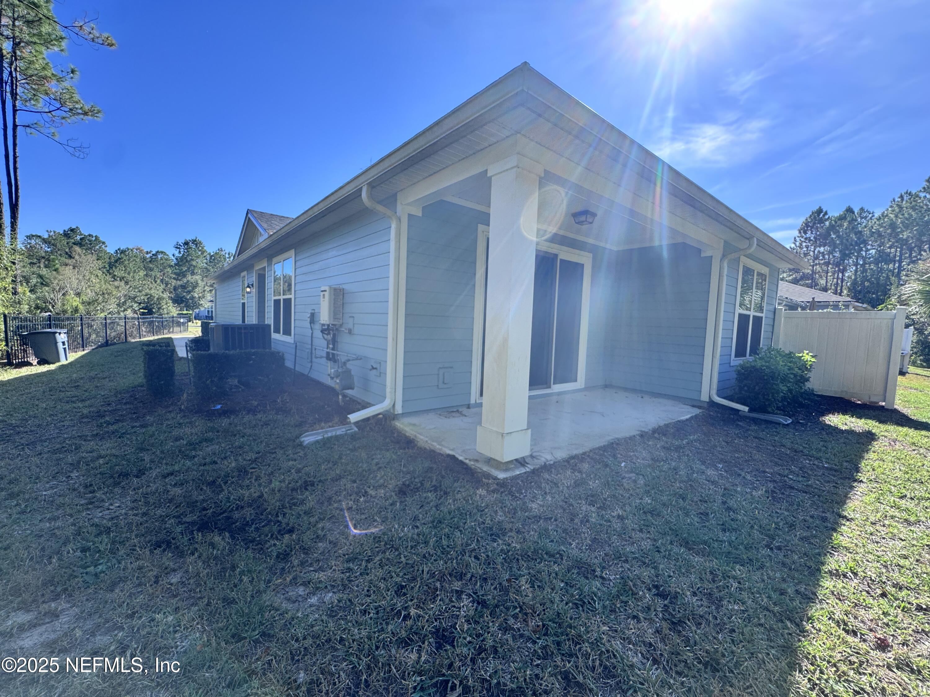 156 Charlie Way St. Augustine, FL 32095 - Photo 29 of 33 a view of a house with backyard and garden