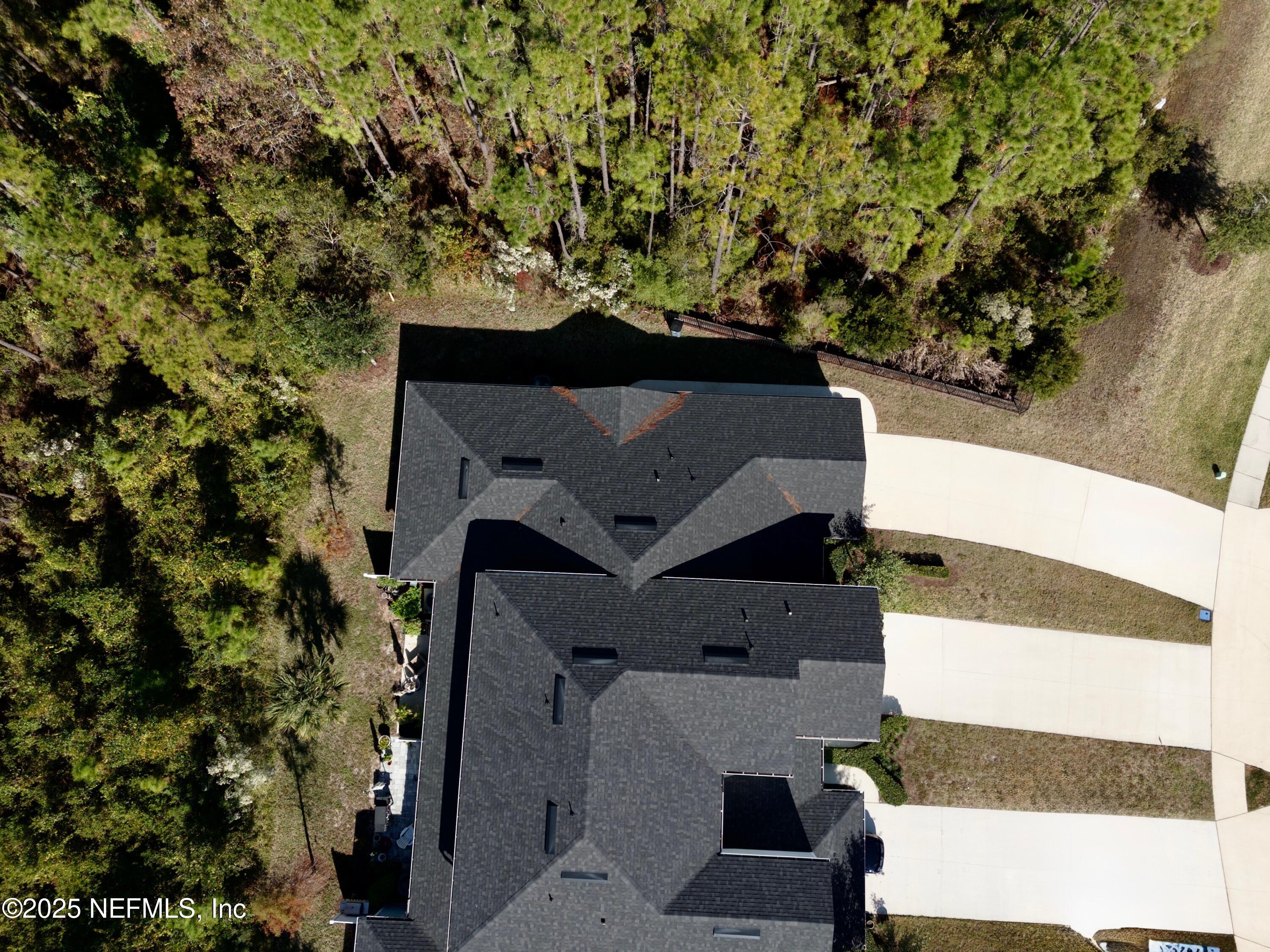 156 Charlie Way St. Augustine, FL 32095 - Photo 31 of 33 an aerial view of a house with a yard