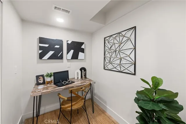 a view of a workspace with furniture