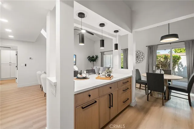 a spacious bathroom with a double vanity sink a toilet and a window