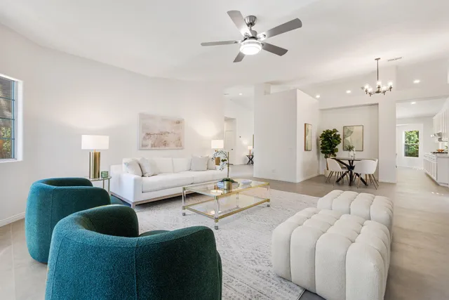 a view of empty room with wooden floor and windows
