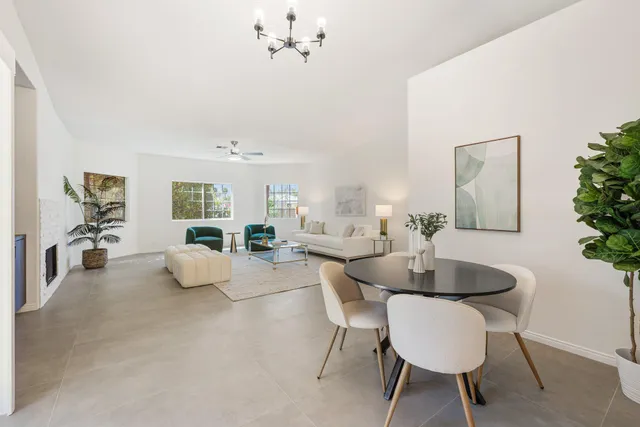 a spacious bathroom with a double vanity sink a large mirror and shower