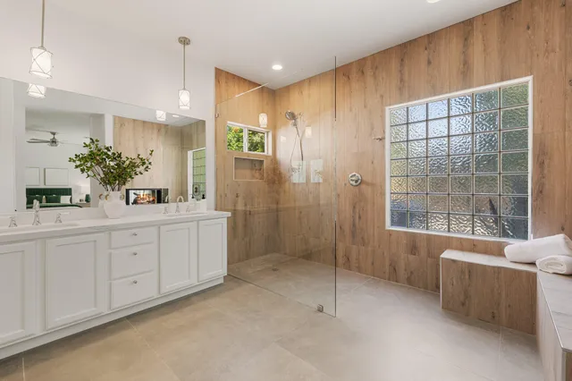 a bathroom with a toilet sink and shower