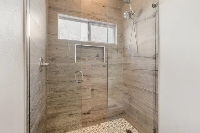 a view of a chair and table in the backyard