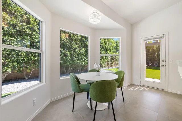 a kitchen with refrigerator a sink and cabinets