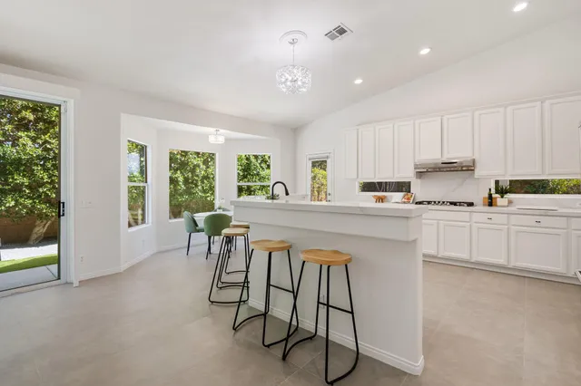 a kitchen with a sink and a window