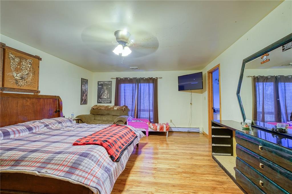 420 Three Degree Road Renfrew, PA 16053 - Photo 12 of 25 a bedroom with a bed and a chandelier