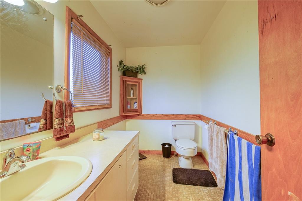 420 Three Degree Road Renfrew, PA 16053 - Photo 13 of 25 a bathroom with a sink and a mirror
