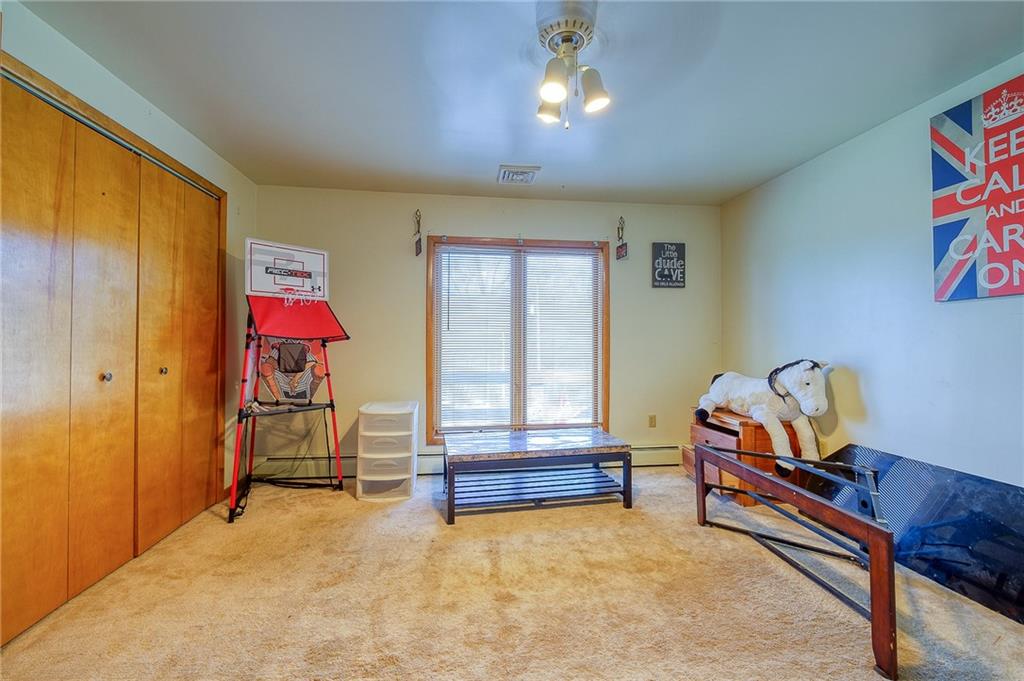 420 Three Degree Road Renfrew, PA 16053 - Photo 18 of 25 a living room with furniture gym equipment and a window