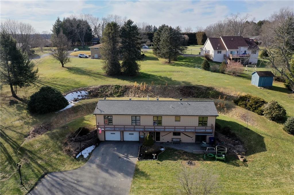 420 Three Degree Road Renfrew, PA 16053 - Photo 23 of 25 an aerial view of a house with garden space and a car parked