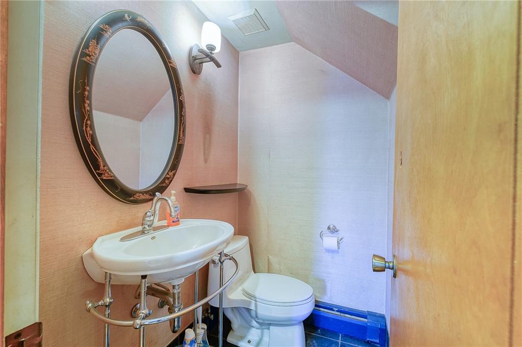 420 Three Degree Road Renfrew, PA 16053 - Photo 5 of 25 a bathroom with a toilet a sink and a mirror