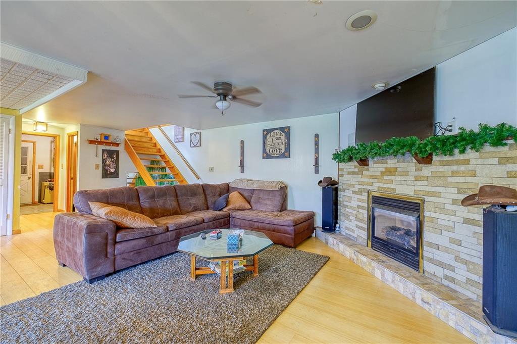 420 Three Degree Road Renfrew, PA 16053 - Photo 8 of 25 a living room with furniture and a fireplace