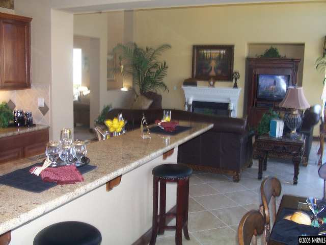 14065 Winners Cup Drive Reno, NV 89521 - Photo 6 of 9 a living room with furniture and flowers