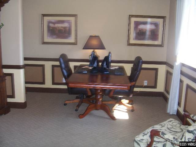14065 Winners Cup Drive Reno, NV 89521 - Photo 7 of 9 a workspace with furniture and a lamp