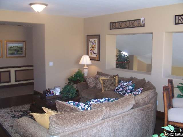 14065 Winners Cup Drive Reno, NV 89521 - Photo 8 of 9 a living room with furniture flowerpot and a mirror