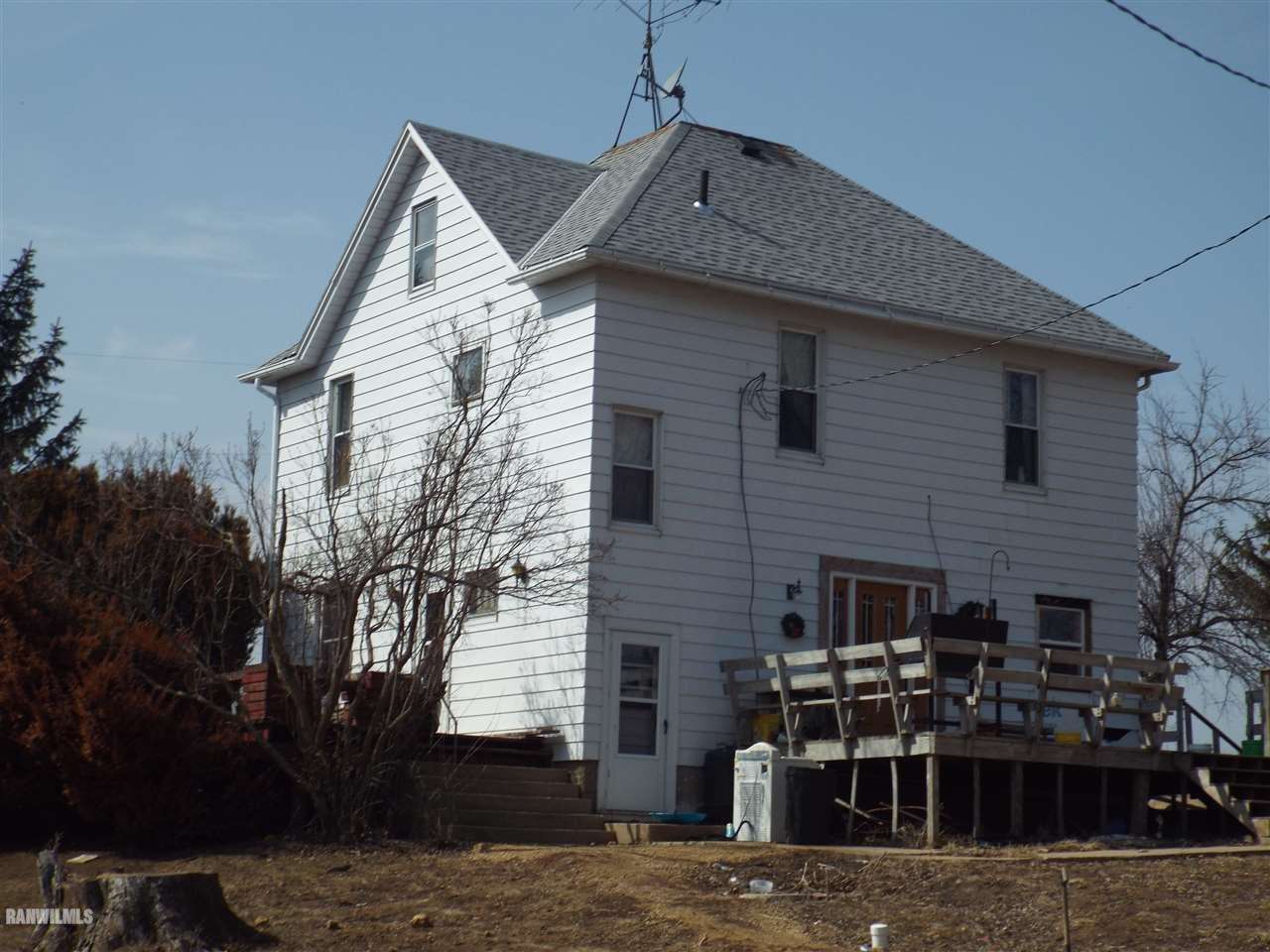 a front view of a house with garage