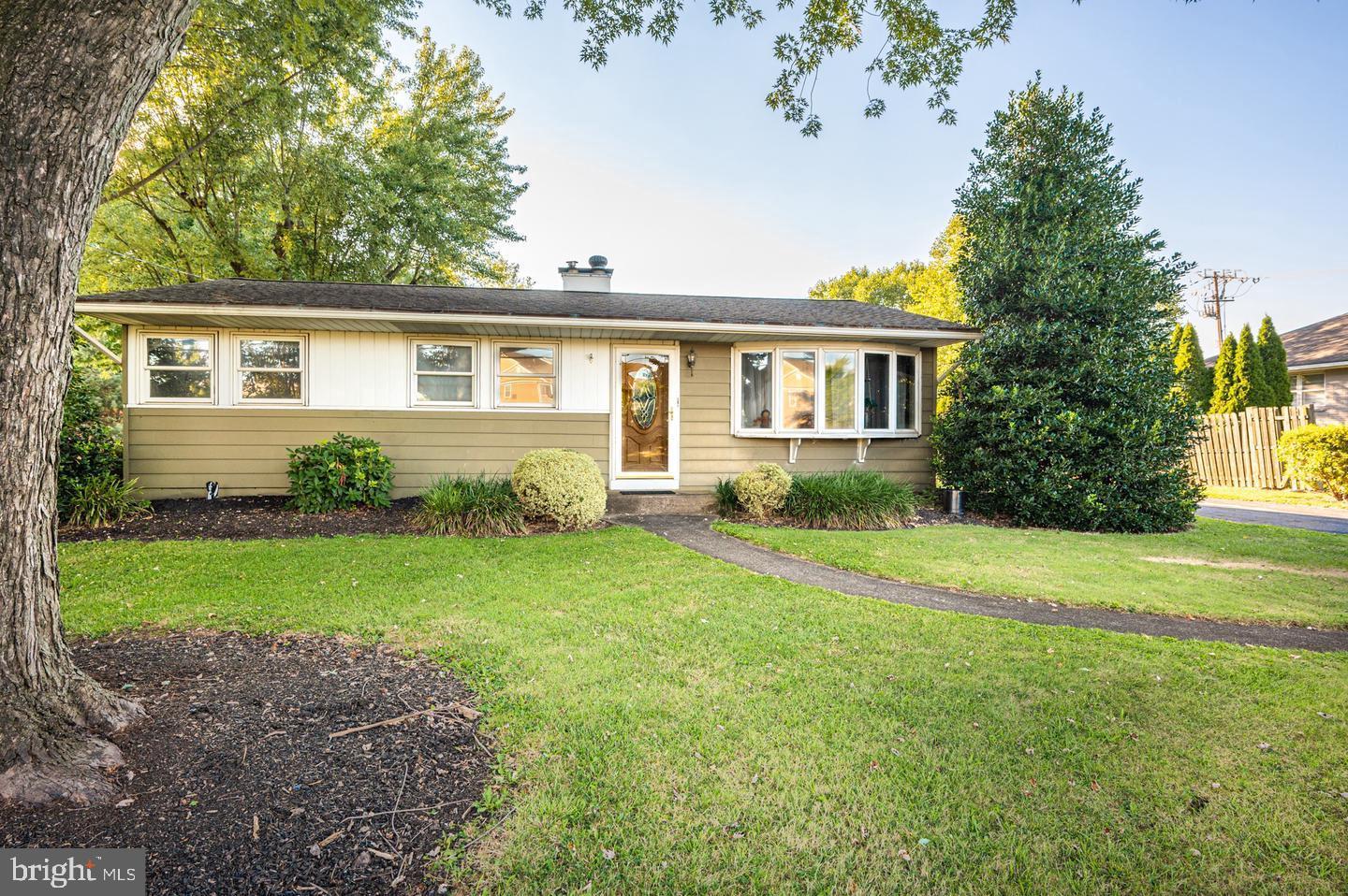 front view of a house and a yard