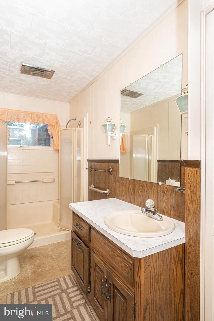 691 North Lewis Road Royersford, PA 19468 - Photo 15 of 21 a bathroom with a sink a toilet and shower