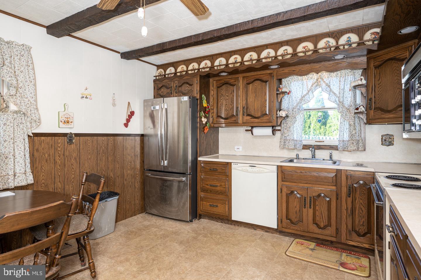 691 North Lewis Road Royersford, PA 19468 - Photo 16 of 21 a kitchen with a refrigerator window and chairs