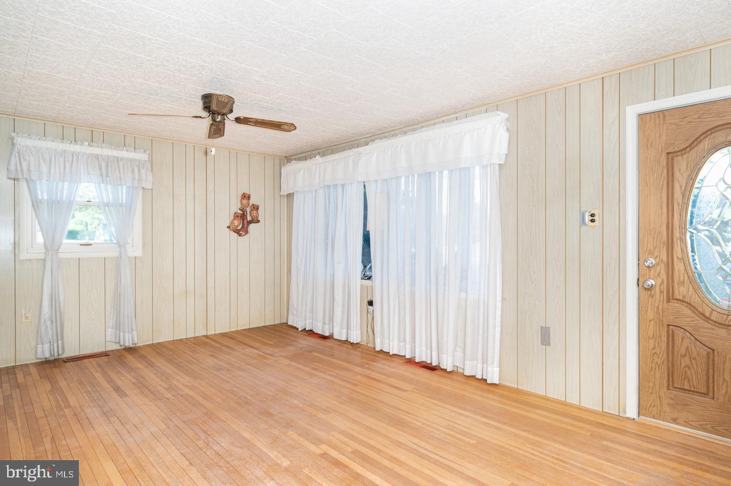 691 North Lewis Road Royersford, PA 19468 - Photo 3 of 21 a view of a bedroom with wooden floor and windows
