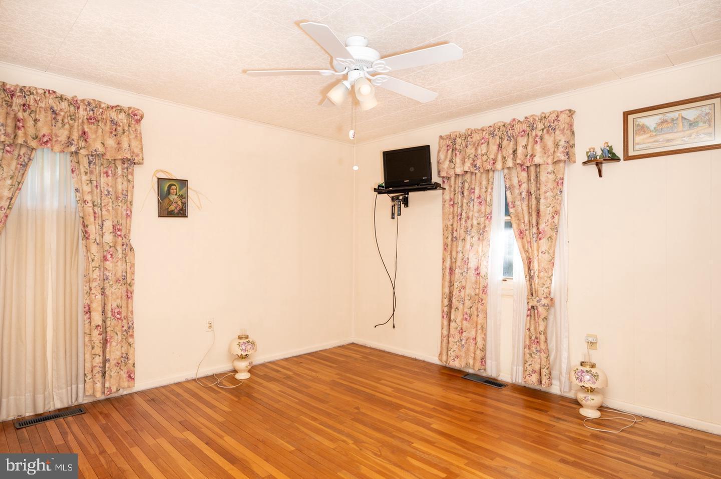 691 North Lewis Road Royersford, PA 19468 - Photo 5 of 21 a view of empty room with wooden floor and ceiling fan