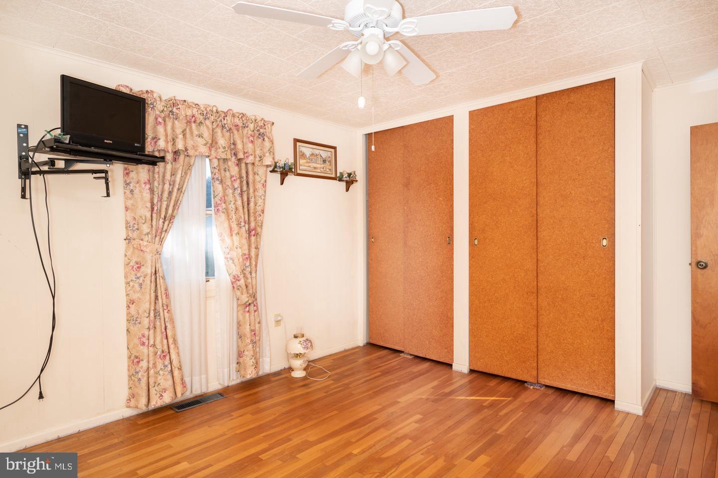 691 North Lewis Road Royersford, PA 19468 - Photo 6 of 21 a view of a livingroom with wooden floor and a ceiling fan
