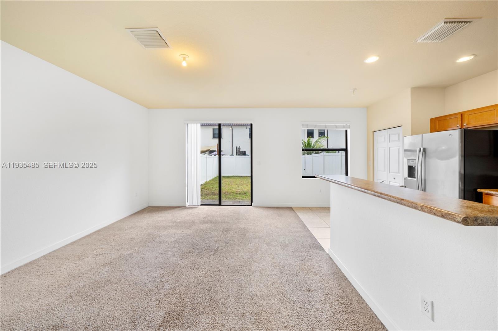 3366 West 90th Terrace Hialeah, FL 33018 - Photo 3 of 22 a view of a kitchen with a sink and a refrigerator