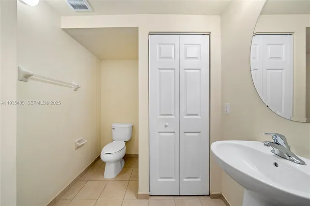 a bathroom with a toilet and a sink