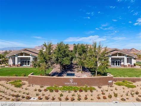 498 Pebble Run Avenue Henderson, NV 89011 - Photo 32 of 47 Experience community living with this inviting entrance featuring well-maintained landscaping and accessible architecture.
