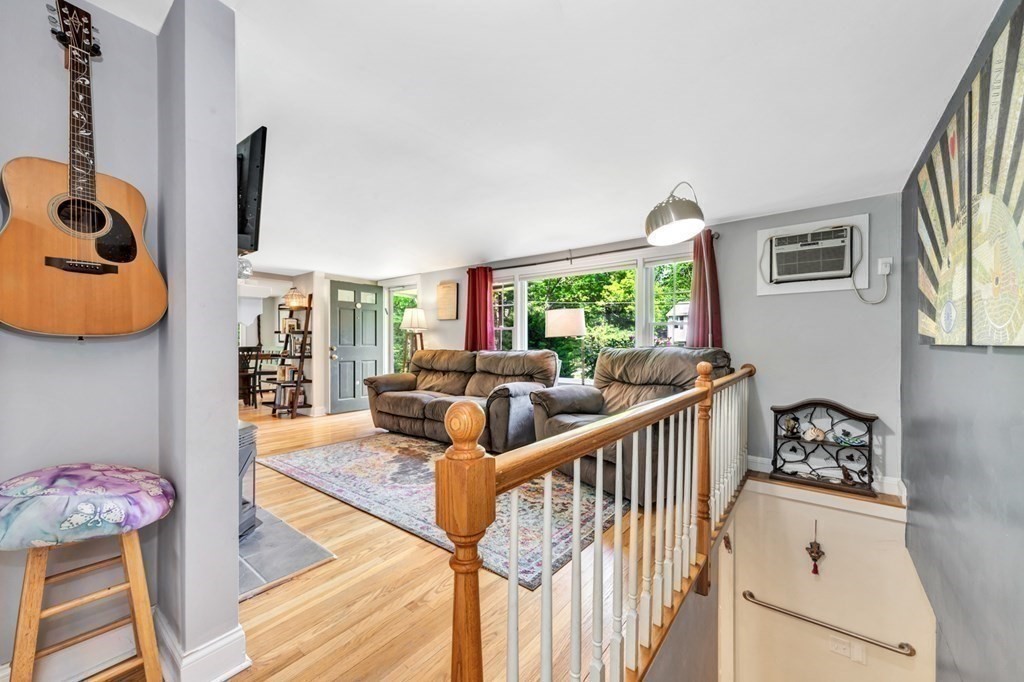 49 Woodland Road Ashland, MA 01721 - Photo 12 of 36 a living room with furniture and a wooden floor