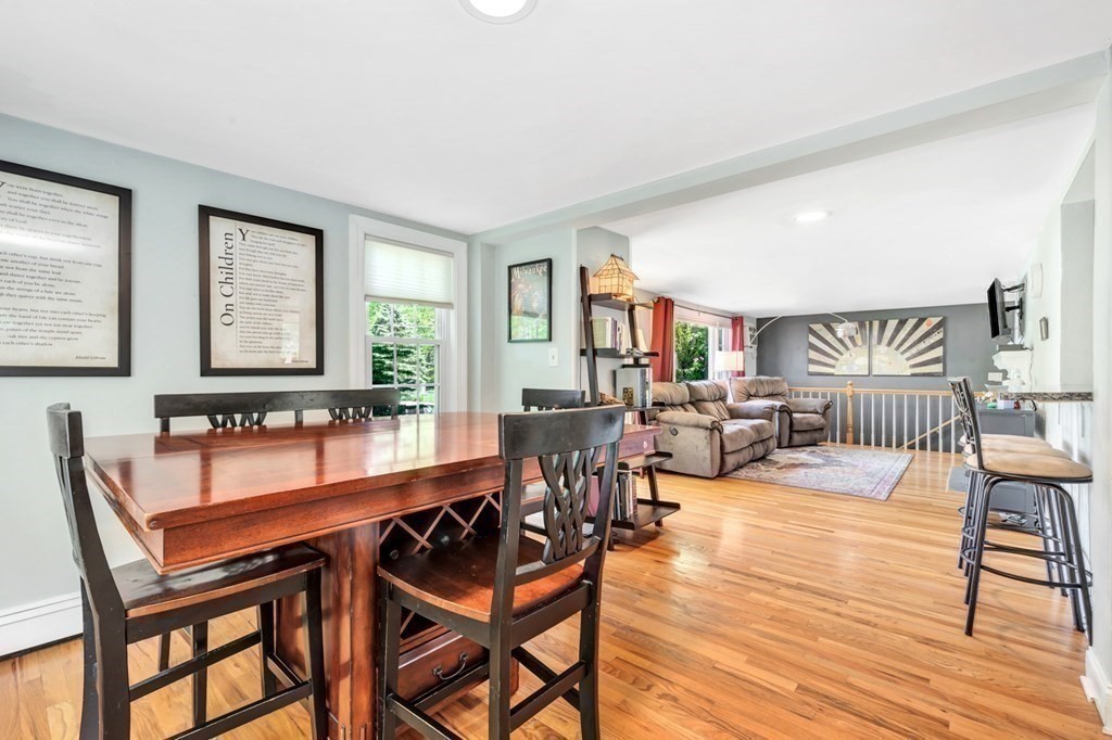 49 Woodland Road Ashland, MA 01721 - Photo 15 of 36 a view of a dining room with furniture and wooden floor