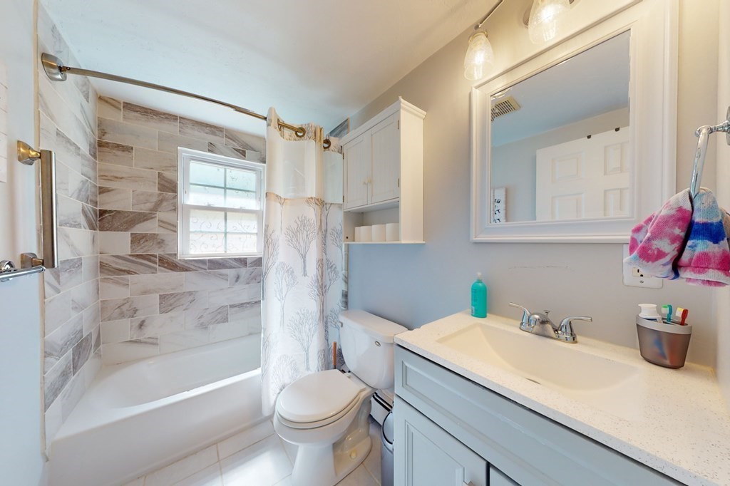 49 Woodland Road Ashland, MA 01721 - Photo 16 of 36 a bathroom with a granite countertop sink toilet and shower
