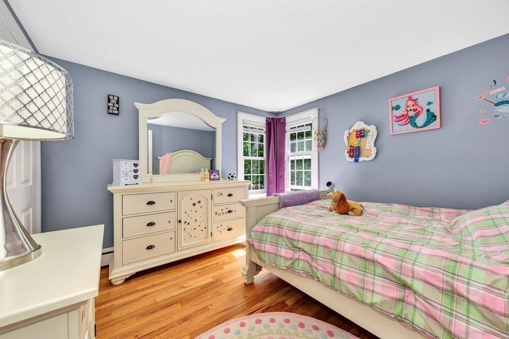 49 Woodland Road Ashland, MA 01721 - Photo 24 of 36 a bedroom with a bed and a dresser in it