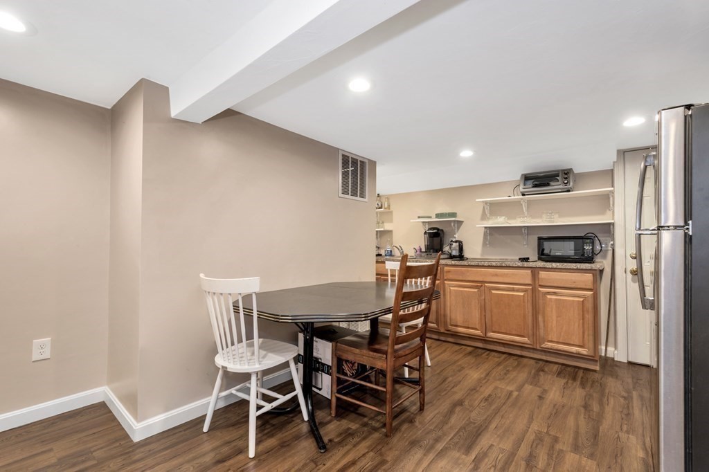 49 Woodland Road Ashland, MA 01721 - Photo 25 of 36 a view of a dining room with furniture and wooden floor