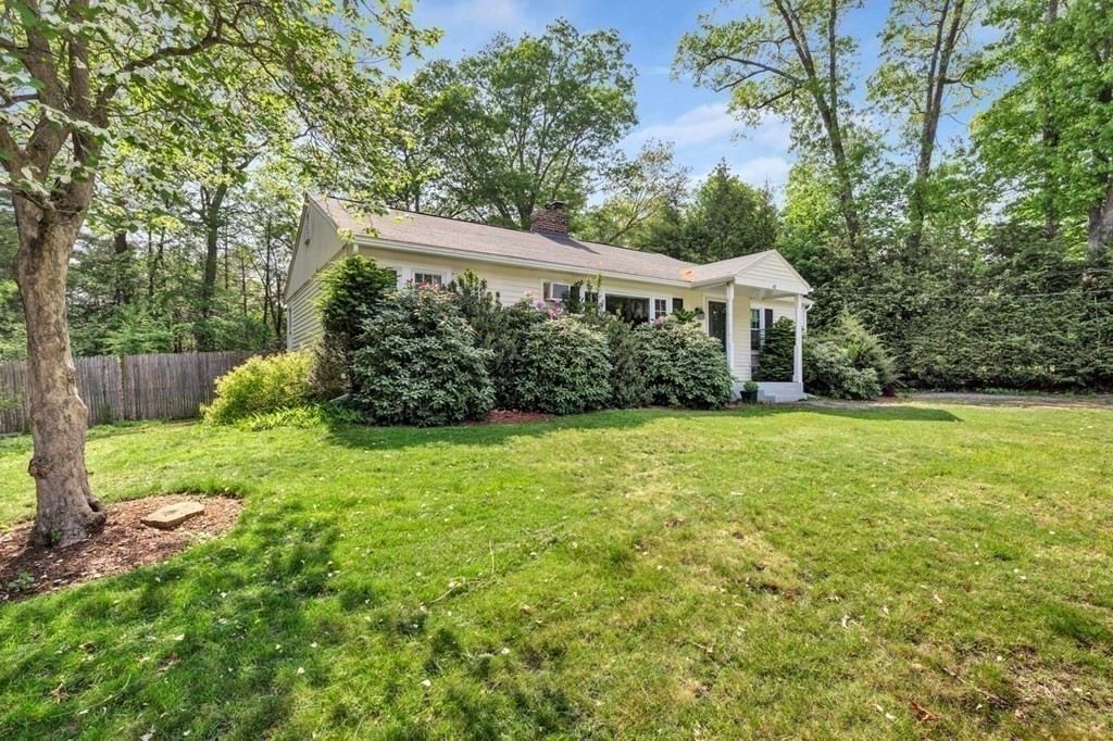49 Woodland Road Ashland, MA 01721 - Photo 32 of 36 a front view of a house with garden